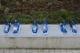 18 Pairs of Blue and White Running Shoes by Gathie Falk - photo by Maureen Smith